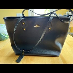 Coach black leather tote in mint condition.
